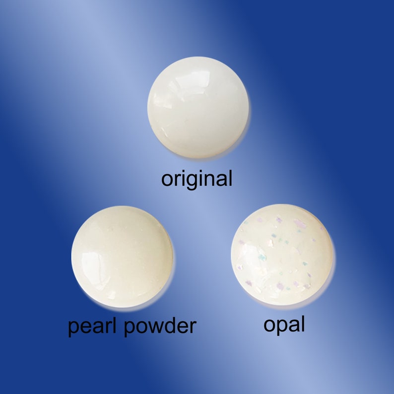 May include: Three white round objects, one plain, one with a pearlescent finish, and one with a glittery opal finish. The objects are labeled "original", "pearl powder", and "opal".