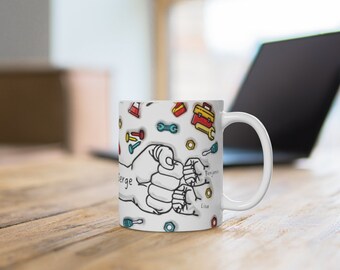May include: White ceramic mug with a colorful design of three hands clasped together, with the names "Serge", "Lisa", and "Benjamin" written below. The mug is surrounded by small colorful tools and objects.
