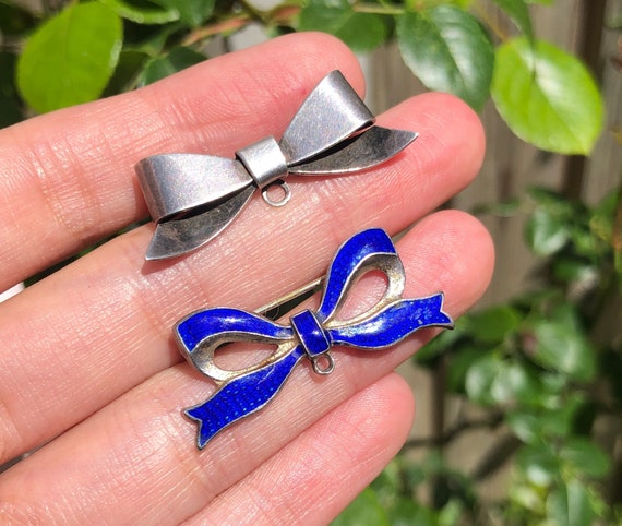 Two Antique Silver Blue Enamel Bow Charm Brooches 