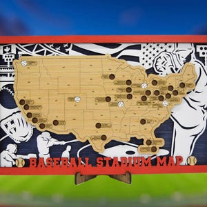 May include: Wooden baseball stadium map in a red frame. The map shows a laser-cut design of the United States, with baseballs marking stadium locations. The words "BASEBALL STADIUM MAP" are at the bottom. The background includes baseball-themed silhouettes.