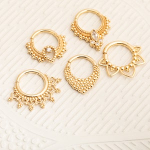 thumbnail interactive-video image 1 of 14K Solid Gold Septum Clicker Ring - 16G 4mm, Secure Hinged Closure 1 of 9