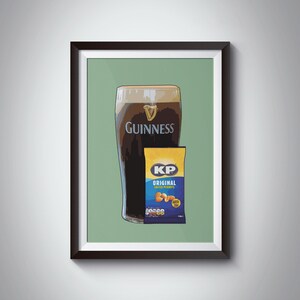 May include: A framed illustration of a glass of Guinness beer and a bag of KP Original salted peanuts. The background is a light green color.