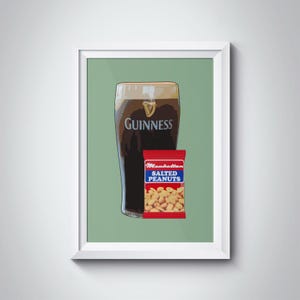 May include: A framed illustration of a pint of Guinness beer with a bag of salted peanuts in front of it. The background is a light green colour.