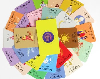 May include: A set of 22 tarot cards with colorful backgrounds and French text. Each card features a unique illustration and a number and Roman numeral. The cards are arranged in a circle.