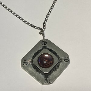 Beautiful pewter jewelry from Svenskt Tenn.  Sweden