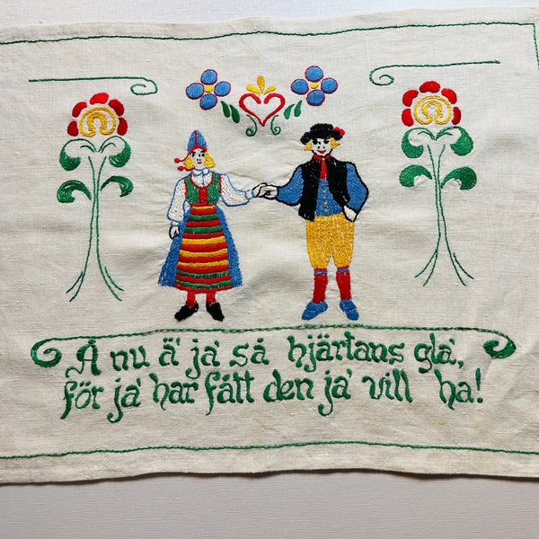 A really nice vintage hand-embroidered wall hanging / tapestry with Swedish dala motifs