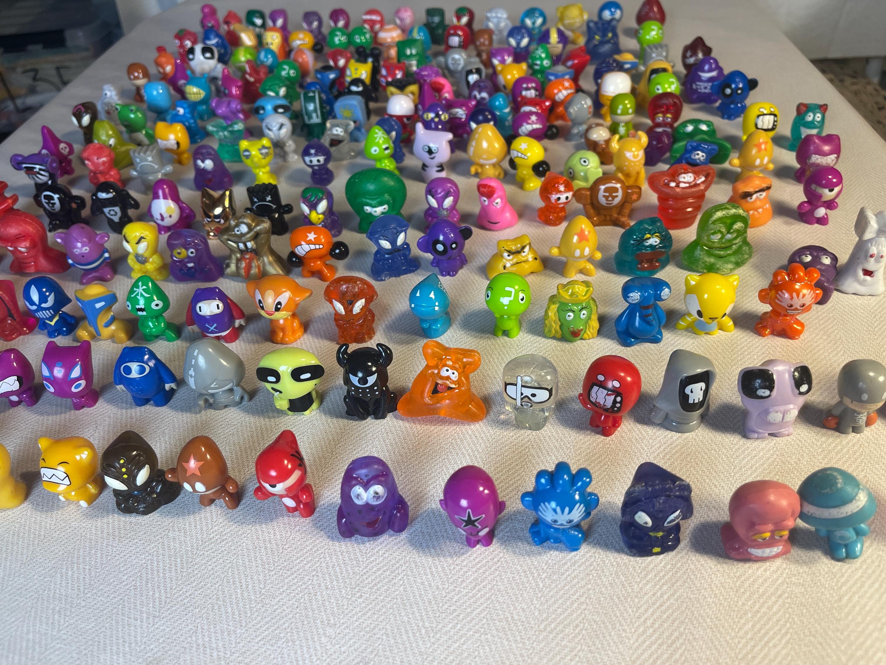 100 Pcs Crazy Bones Gogos / Dracco Heads and Other Mini Monsters