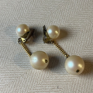 A pair of larger vintage 1950&#39;s ear clips  with hanging pearls