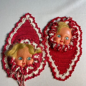 2 vintage crochet potholders with doll faces.  Red and white