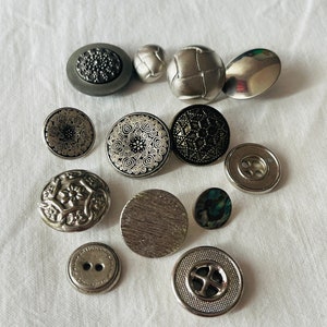 13 beautiful vintage metallic colored buttons in different materials and different styles