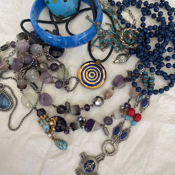 This is a 1/2 pound lot of broken and not, vintage and newer craft jewelry. The majority of these are wearable or for crafts, Blue tones