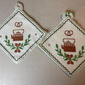 Hand embroidered pot holders, from Sweden