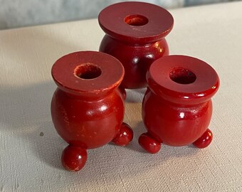 3 vintage traditional Swedish red wooden candlesticks with three orbs as feet