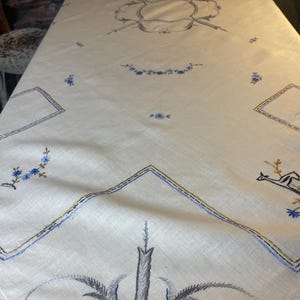 Very nice hand-embroidered tablecloth with lace al around, from Sweden