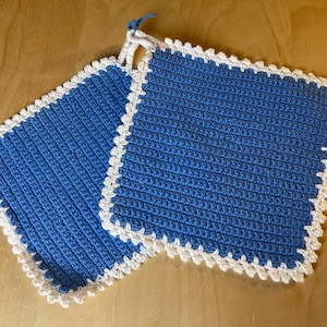 Beautifully hand-crocheted potholders in blue and white