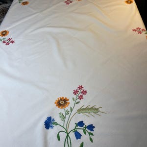 A super nice hand-embroidered summer tablecloth, from Sweden