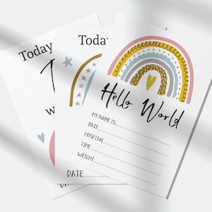 May include: A rainbow-themed baby announcement card with the text "Hello World" and a space to fill in the baby's name, date, hospital, time, and weight.