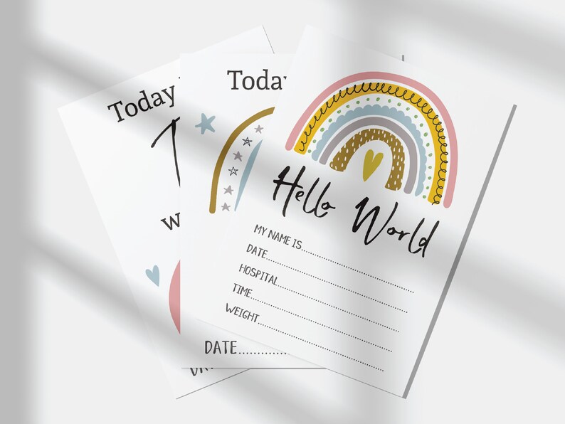May include: A rainbow-themed baby announcement card with the text "Hello World" and a space to fill in the baby's name, date, hospital, time, and weight.