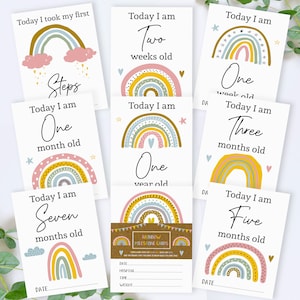 May include: Set of ten rainbow milestone cards for a baby's first year. Each card features a rainbow with different colours and patterns, along with the text "Today I am" and the age milestone. The cards are designed with a rustic brown background and include a space for the date.