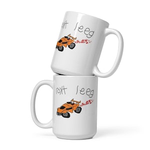 May include: Two white ceramic mugs with a cartoon drawing of a race car and the text "roxt seeg".