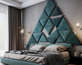 May include: A teal upholstered bed frame with a geometric headboard made of teal fabric triangles. The bed has a white and gray bedding set and a gray throw blanket.