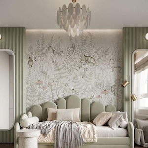 May include: A sage green daybed with a curved headboard and decorative cushions. The bed is dressed with a patterned throw. The room features a nature-themed mural and a decorative chandelier. A small side table and a round rug complete the space.