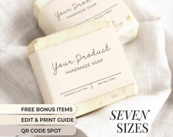 May include: Two white bars of handmade soap with labels that say "Your Product Handmade Soap". The label on the bottom bar also says "Organic & Natural" and "Net. 4oz / 120ml".