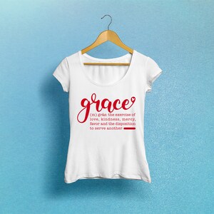 May include: White t-shirt with a red graphic that says "grace" and a definition of the word. The definition is: (m) gr&aring;s: the exercise of love, kindness, mercy, favor and the disposition to serve another.