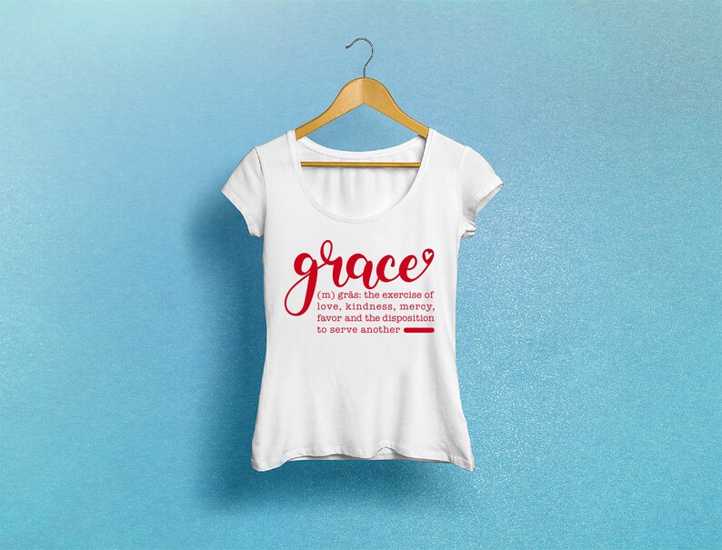 May include: White t-shirt with a red graphic that says "grace" and a definition of the word. The definition is: (m) gr&aring;s: the exercise of love, kindness, mercy, favor and the disposition to serve another.