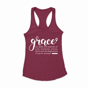 May include: A maroon tank top with the word "grace" written in white cursive lettering. The definition of grace is written below in white text: "(m) gr&aring;s: the exercise of love, kindness, mercy, favor and the disposition to serve another."