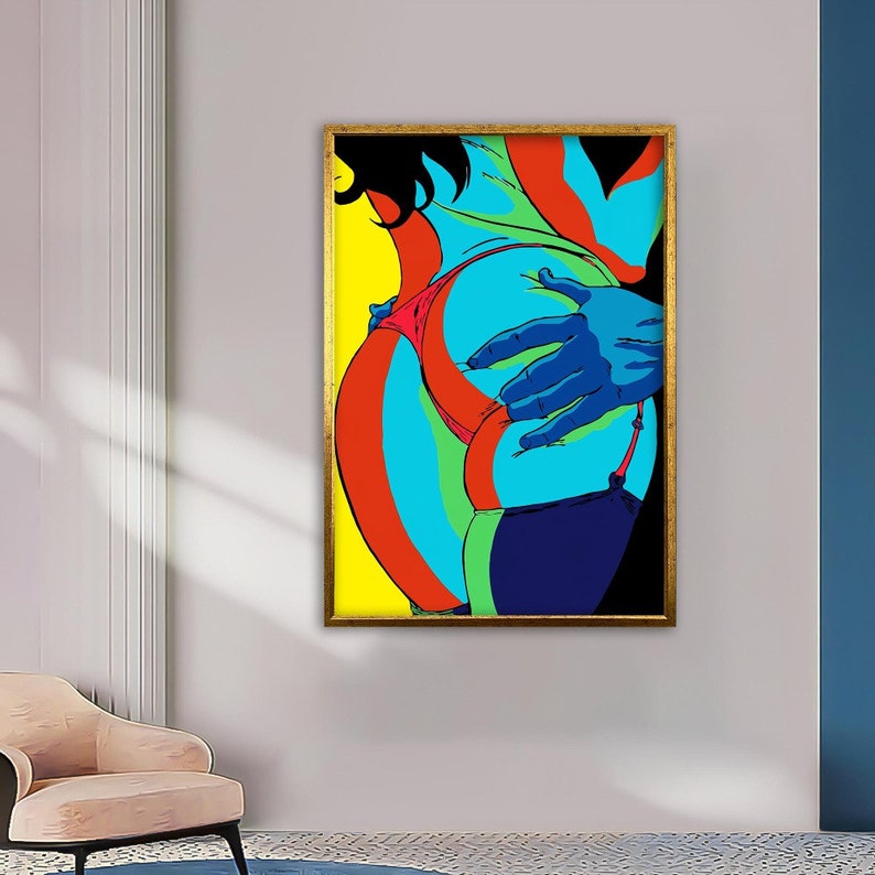 May include: A colorful abstract art print featuring a close-up of a person's body with a hand reaching towards them. The print is framed in gold and has a yellow, red, blue, and green color scheme.