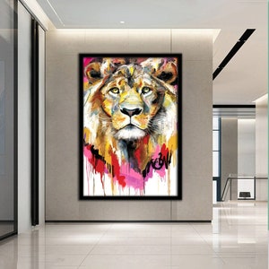 May include: A colorful abstract painting of a lion's face with pink, yellow, and blue paint splatters. The lion's face is in focus, and the background is blurred.