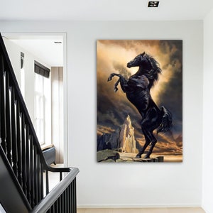 May include: A black horse rears up on its hind legs on a rocky cliff, with a dramatic stormy sky in the background.