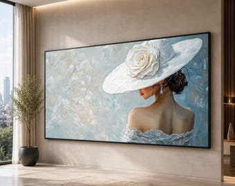 May include: A large rectangular wall art piece featuring an oil painting of a person seen from behind, wearing a wide-brimmed white hat adorned with a large white flower, a white lace-trimmed garment, and a dangling earring against a blue background.