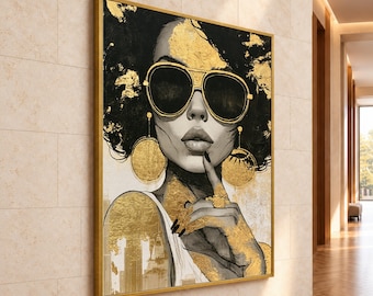 May include: A framed wall art print featuring a stylized portrait of a person with dark hair wearing large black sunglasses and gold circular earrings. The artwork incorporates gold leaf accents on the hair, jewelry, and clothing.