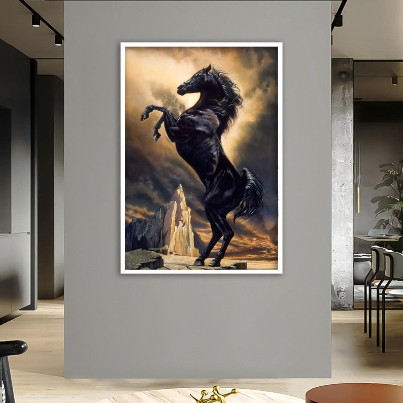 May include: A black horse rears up on its hind legs, against a dramatic, rocky landscape. The horse's mane and tail flow in the wind, and the background is a mix of dark clouds and golden light.