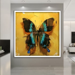 May include: A painting of a blue and black butterfly on a yellow background.