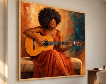 May include: A framed wall art print depicting a person with dark curly hair wearing a rust-colored dress, sitting and playing a light brown acoustic guitar. The background features an abstract oil painting style with warm orange, red, and blue tones.