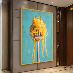 May include: A framed artwork featuring a close-up of a silver fork impaling a mass of yellow spaghetti against a textured, turquoise background. The artwork is framed with a gold border, creating a striking contrast.