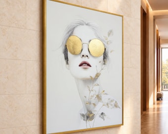 May include: A framed wall art piece featuring a black and white sketch of a person wearing round, textured gold-leaf sunglasses. The artwork includes delicate gold-leaf botanical accents extending from the neck area upward.