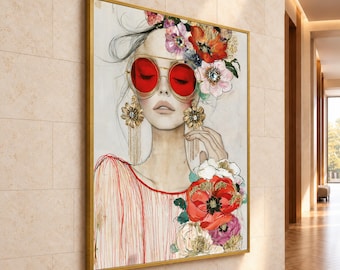 May include: A framed wall art print featuring a stylized illustration of a person wearing round red-tinted sunglasses and large gold dangling earrings, adorned with vibrant red and white floral accents in their hair and on their clothing.