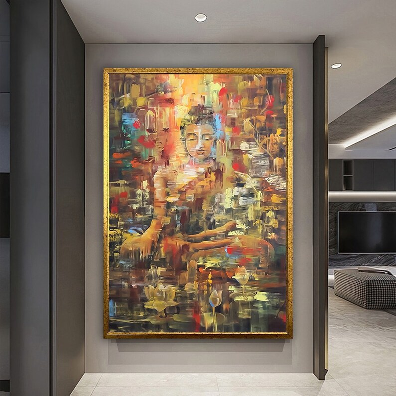 May include: A colorful abstract painting of a meditating Buddha figure in a gold frame. The painting features a mix of warm and cool colors, including shades of yellow, orange, red, blue, and green. The Buddha is depicted in a seated position with hands in a mudra gesture, surrounded by lotus flowers and other abstract elements.