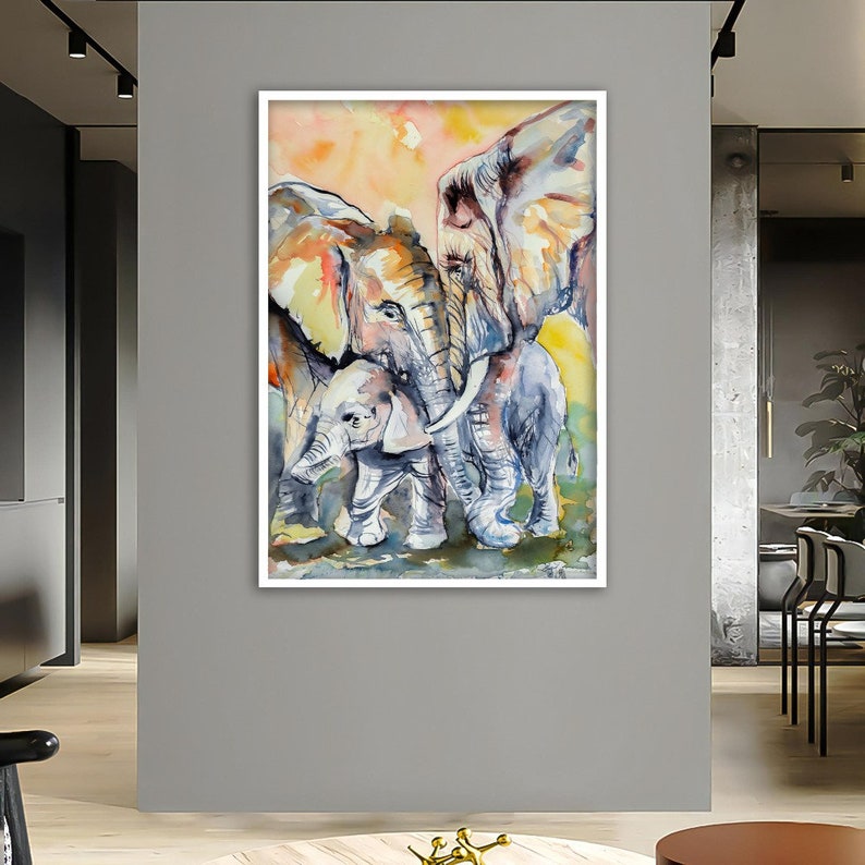 May include: A watercolor painting of three elephants, two large elephants and a baby elephant. The elephants are painted in shades of gray, brown, and pink. The background is a soft yellow and orange.