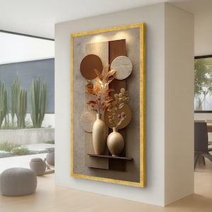 May include: A framed wall art piece with a decorative arrangement. The artwork features two beige vases with golden foliage, set against a backdrop of textured grey, brown, and beige elements. The frame is gold.