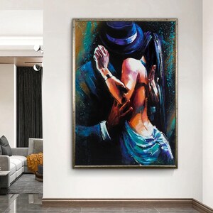 May include: A painting of a couple dancing, the man is wearing a hat and a suit, the woman is wearing a blue dress. The painting is done in a colorful style with bold strokes.