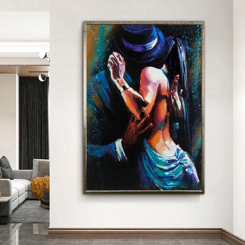 May include: A painting of a couple dancing, the man is wearing a hat and a suit, the woman is wearing a blue dress. The painting is done in a colorful style with bold strokes.