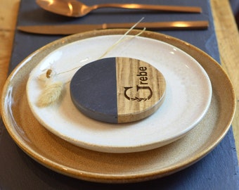 Stylish place card as coaster made of wood with travertine or marble - handmade