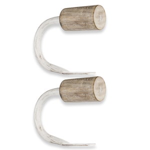 May include: Two white metal curtain hooks with wooden finials. The finials are a light brown color with a distressed finish.