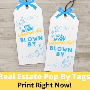 May include: Two white gift tags with blue bows and black strings. The tags have the text "This Summer has BLOWN BY" in blue and yellow, with bubble graphics. The bottom of the image has the text "Real Estate Pop By Tags Print Right Now!"