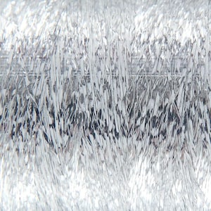May include: Close-up of a spool of silver metallic thread. The thread has a textured, reflective surface, appearing bright and shiny. The thread is tightly wound, creating a dense, solid form. Ideal for crafting and embroidery projects.